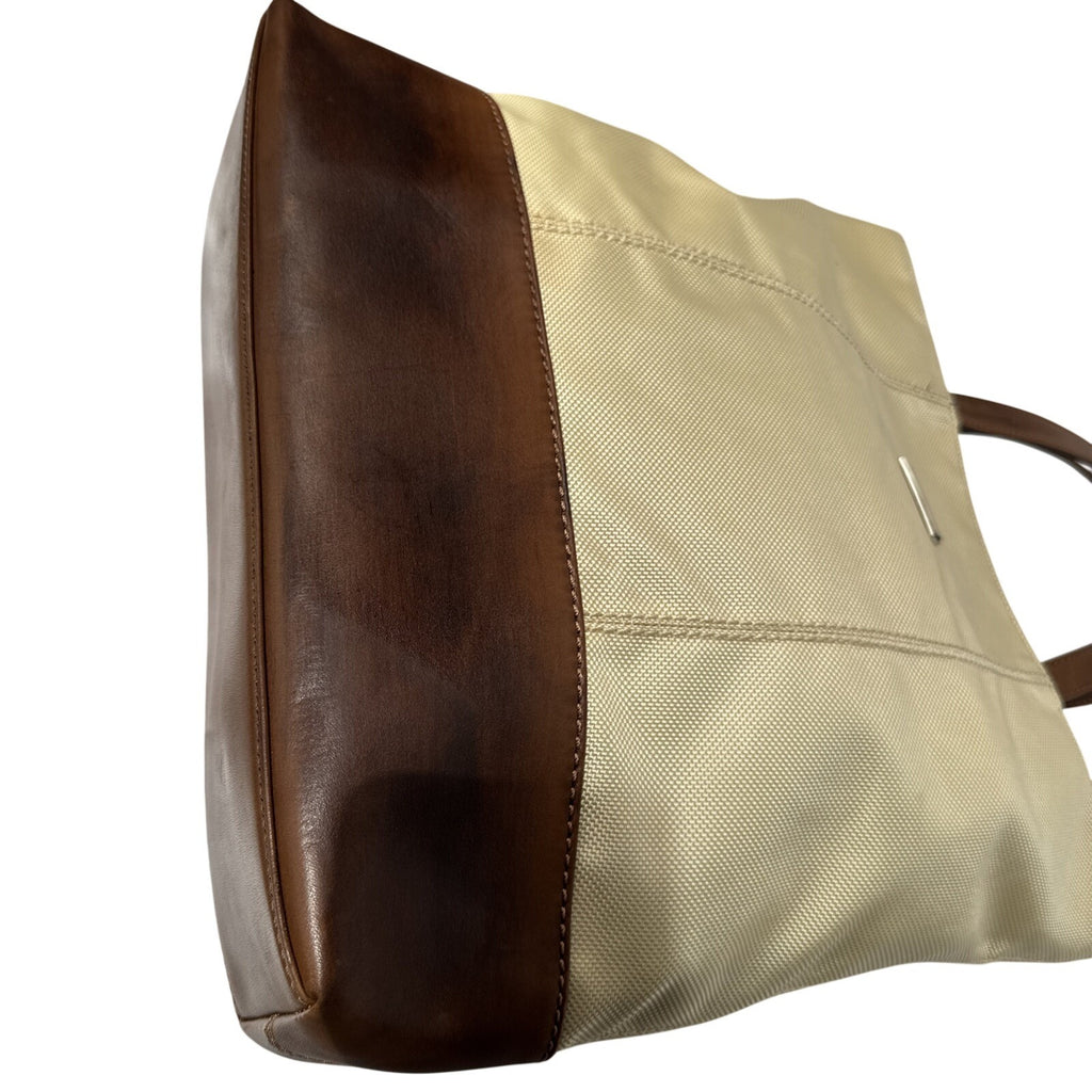 Tumi Beige Canvas & Brown Leather Tote Bag With Rear Zip Pocket And Handles